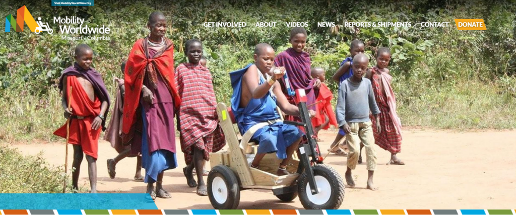 image from Mobility Worldwide-Columbia website - children with boy on cart