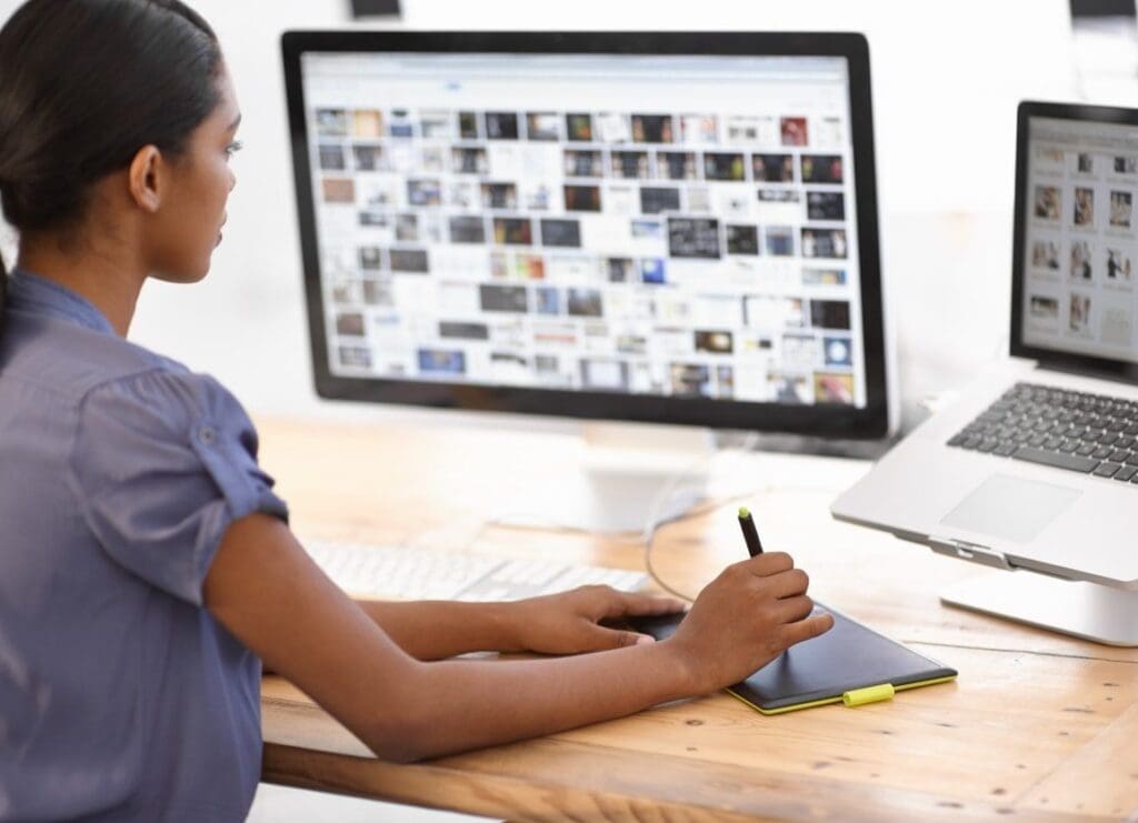 woman selecting images from her computer